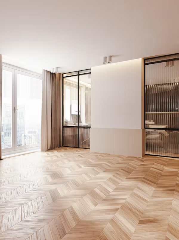 Estancia reformada con suelo de madera en espiga
